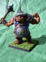 This is the plastic ogre from the Milton Bradley game BattleMasters. I stuck on a Citadel plastic shield but otherwise it's vanilla. If I recall correctly, Citadel also made a very similar model in metal.