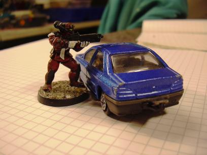 Warzone ashigaru next to a 1:60 Peugeot 406.