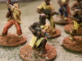 He came out a bit bland from the sepia wash, so I washed the skin again with pure black. I think that turned out pretty well... unlike the sepia shade on the white cloth. Bad bad idea, never to be repeated.