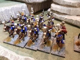 Cuirassiers lead the way with the general.