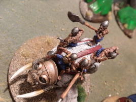 Even on a mammoth he's pointing the spear up...